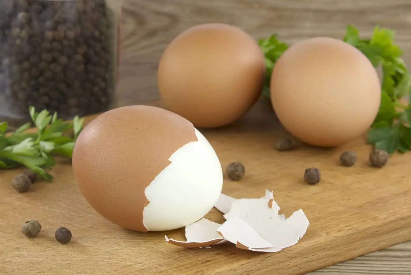An image of a hard boiled egg on a countertop