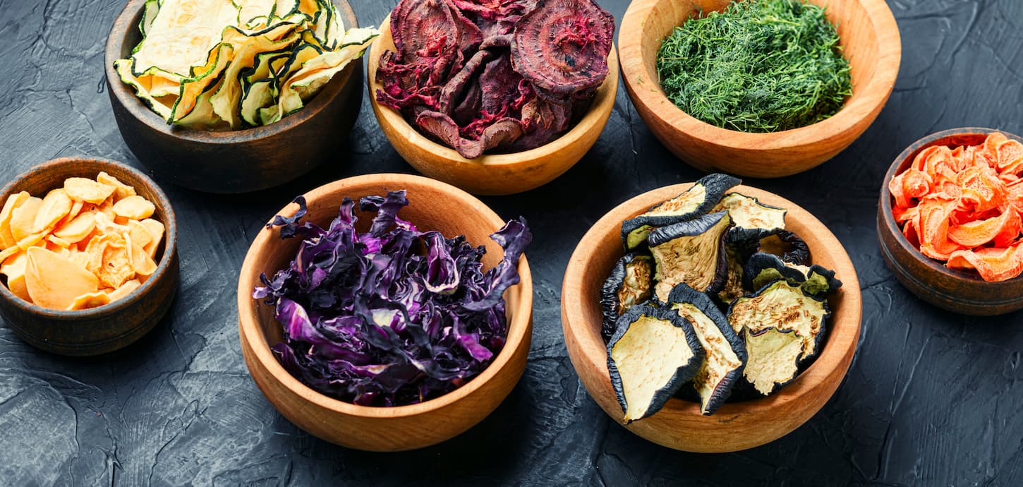 An image of assorted dried vegetables in separate bowls.
