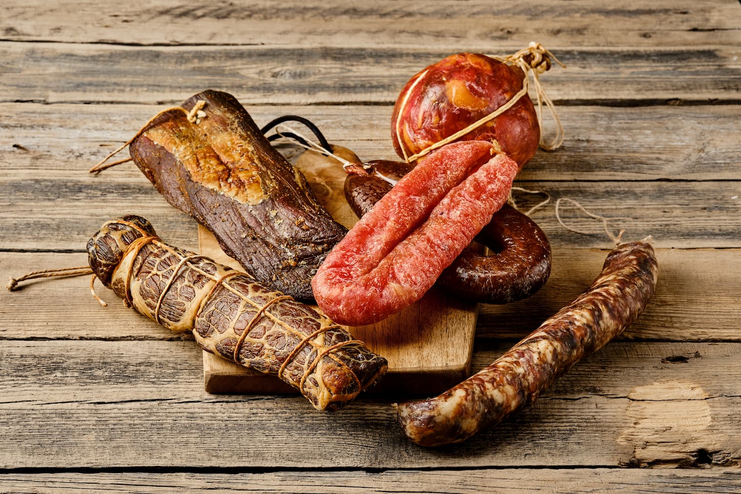 An image of various dried meat and sausages.