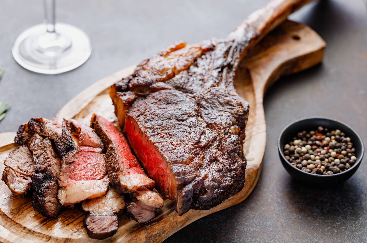 An image of Grilled dry-aged marble beef steak Tomahawk.