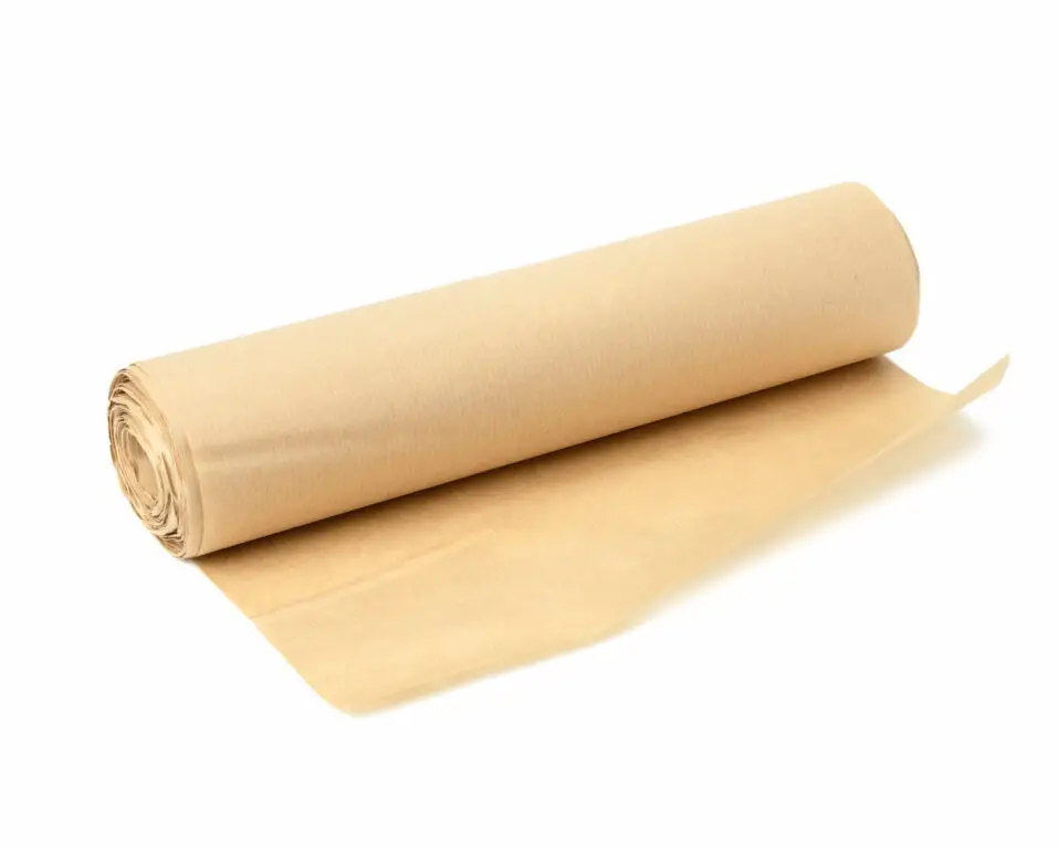 An image of brown parchment paper rolled on a white background.