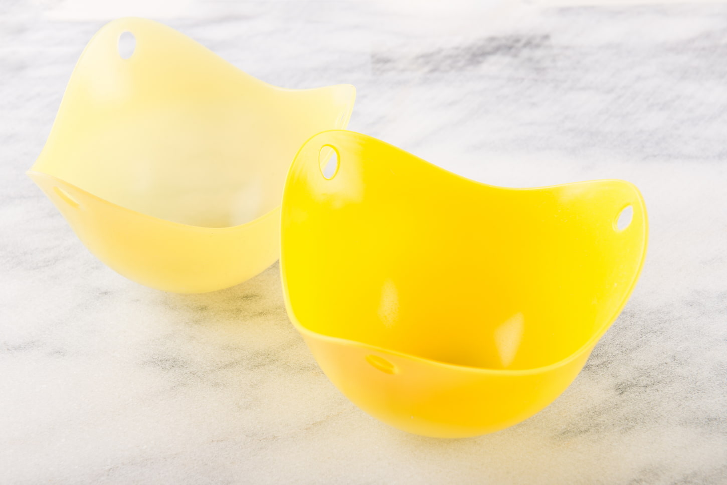 An Image of Silicone Egg Poachers on Marble Background.