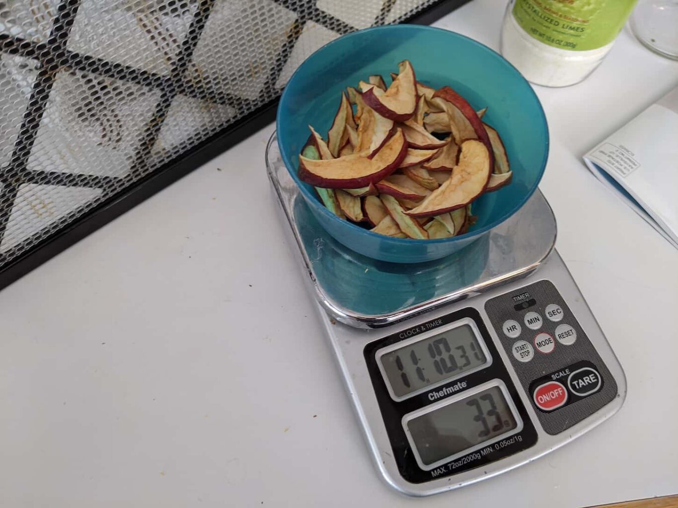 An image of dehydrated apples being weighed.