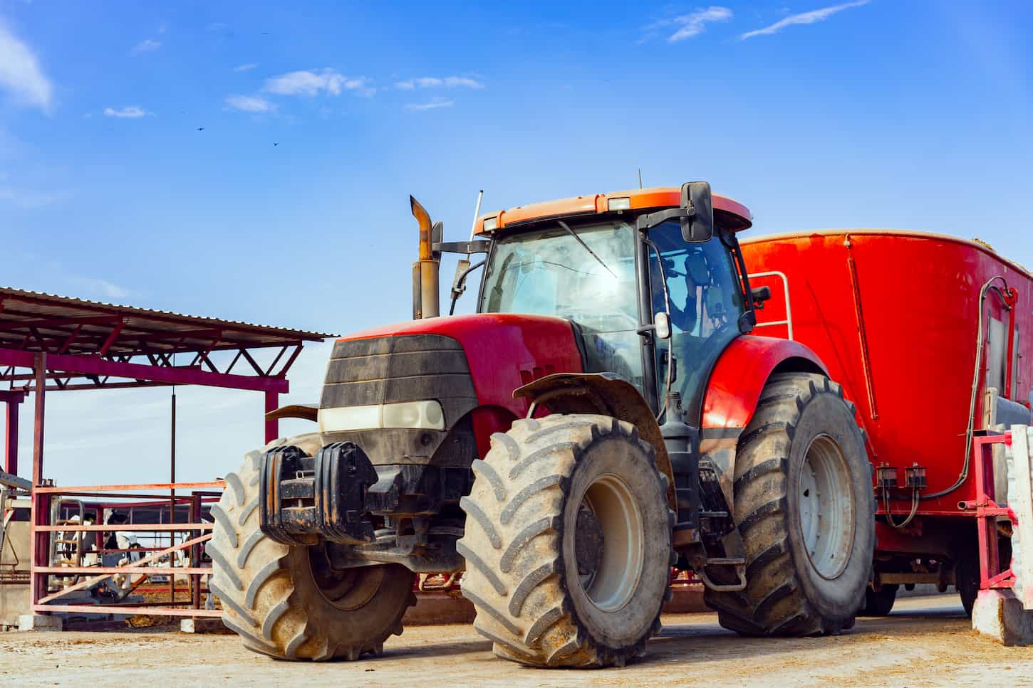 An image of Modern red agricultural tractor in a farm