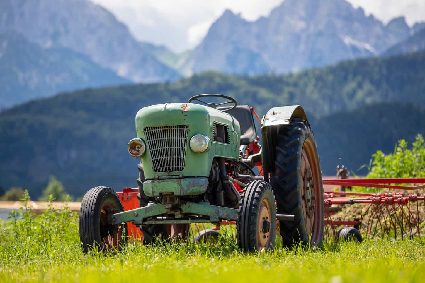 An image of Old tractor in the Alpine meadows.