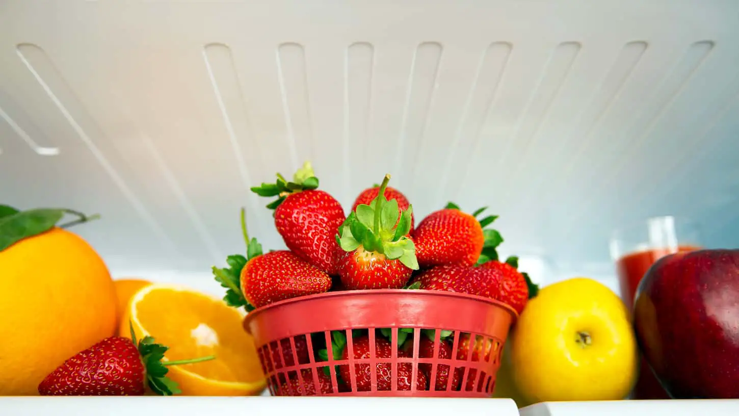 An image of many different fresh tasty fruits in the refrigerator, organic nutrition, fruits diet, weight loss concept.