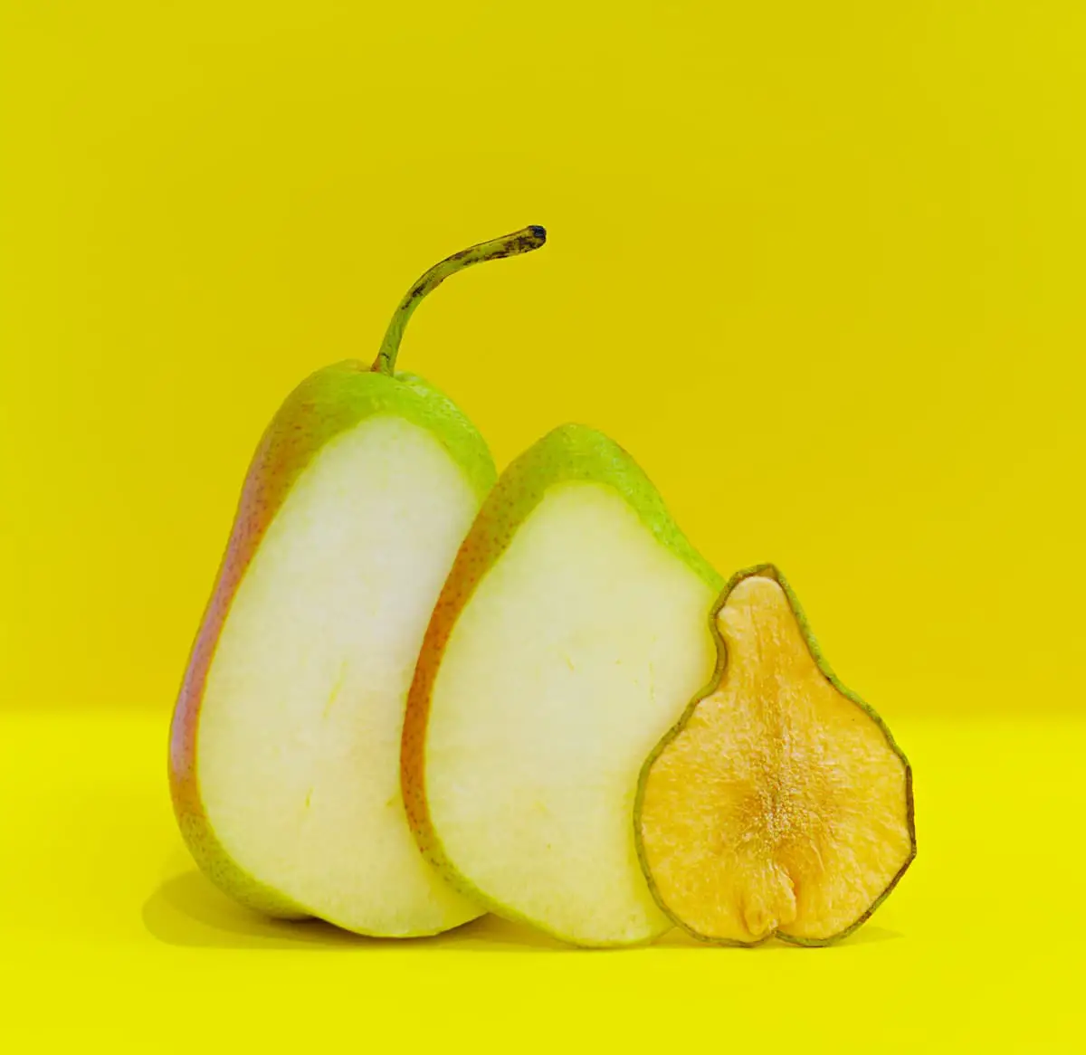 An image of a sliced pear, some dried or freeze-dried.